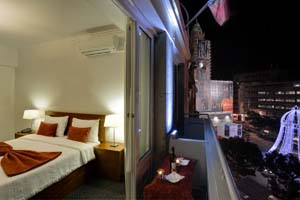 Comfort double with city view, balcony, private facilities (bath), and breakfast